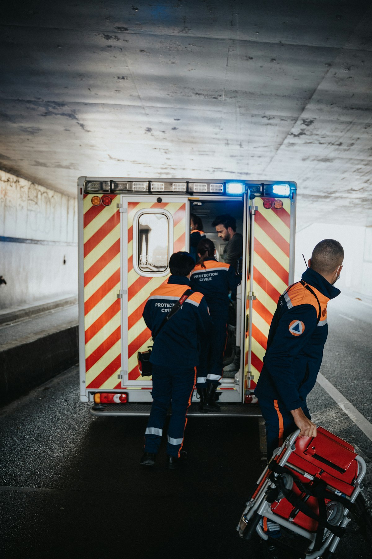 Emergency response team boarding an ambulance